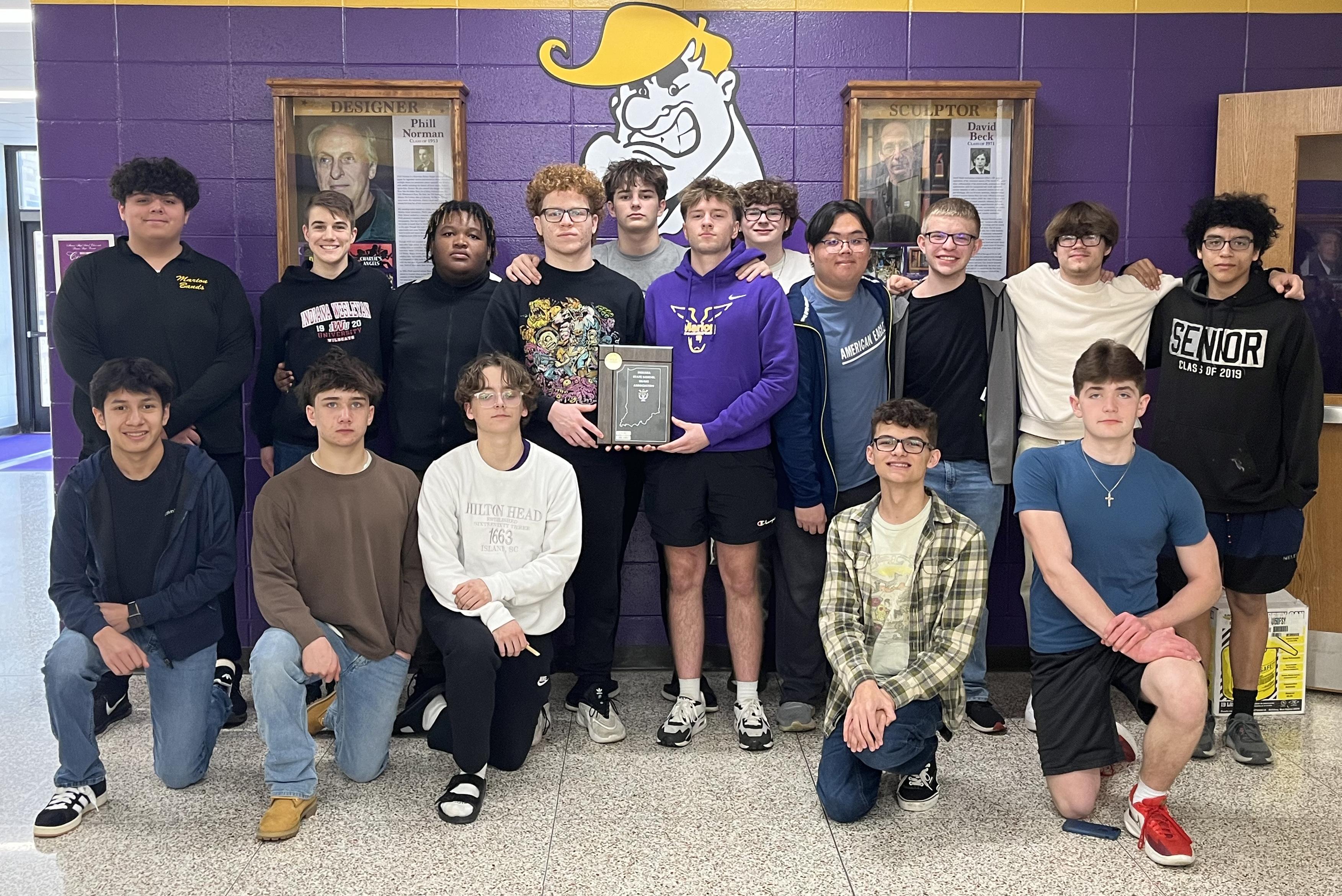 Marion High School Jazz 1 ensemble poses for a photo with their ISSMA Jazz Competition plaque for their Group I Gold rating in March 2024 